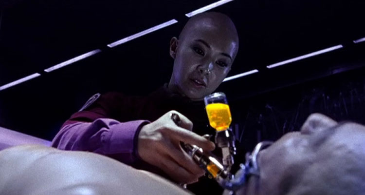 Dante 01 2008 Movie Scene Linh-Dan Pham as Elisa injecting something into Lambert Wilson as Saint-Georges neck