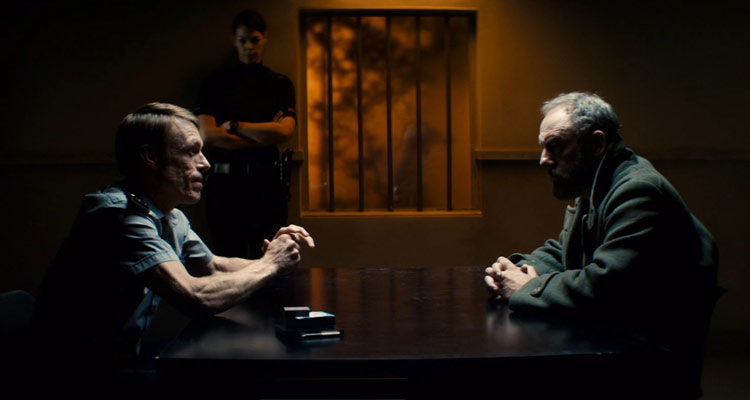 Let Us Prey Movie 2014 Liam Cunningham as Six being interogating in a police station by Douglas Russell as Sgt. MacReady