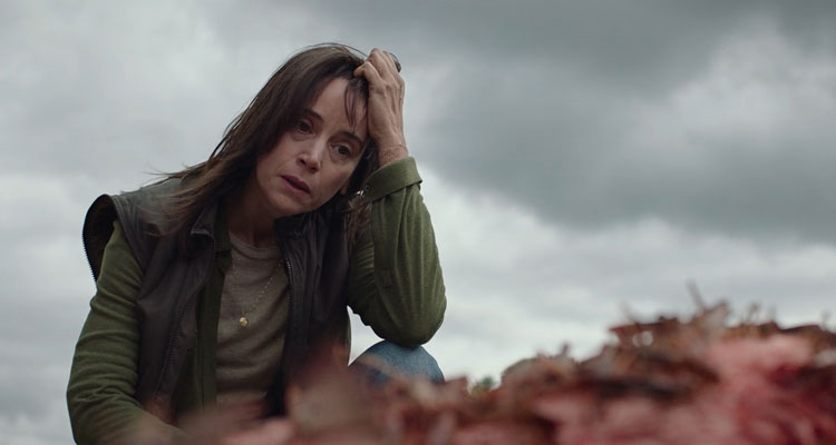 The Swarm AKA La Nuee 2020 Movie Scene Suliane Brahim as Virginie Hébrard looking at the goat that's being eaten alive by locusts