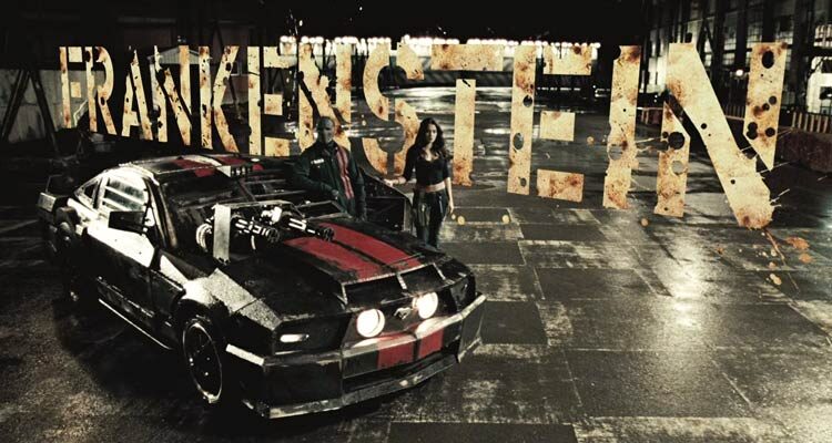 Death Race 2008 Movie Scene Jason Statham as Jensen Ames AKA Frankenstein and Natalie Martinez as Case standing next to their car a 2006 Ford Mustang GT with Gatling guns