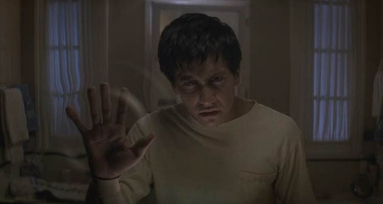 Donnie Darko 2001 Movie Scene Jake Gyllenhaal as Donnie Darko touching his mirror and creating ripples apparently opening a time portal