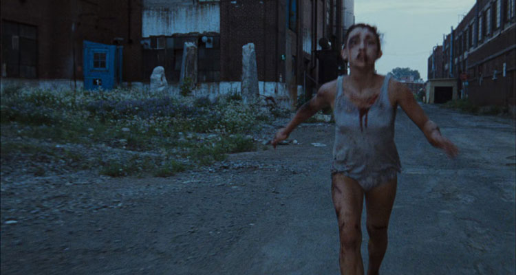 Martyrs 2008 Movie Scene Jessie Pham as young Lucie running away from the building