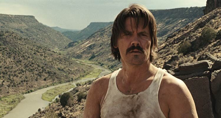No Country For Old Men 2007 Movie Scene Josh Brolin as Llewelyn Moss after escaping the criminals in the river