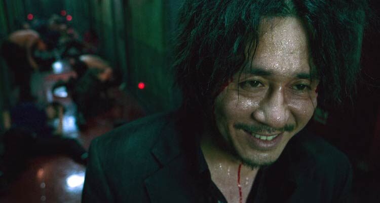 Oldboy 2003 Movie Scene Choi Min-sik as Dae-su Oh laughing after beating up a hallway full of people