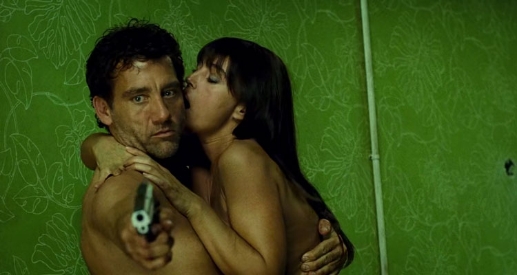 Shoot Em Up 2007 Movie Scene Clive Owen as Smith holding a gun and having sex with Monica Bellucci as Donna at the same time