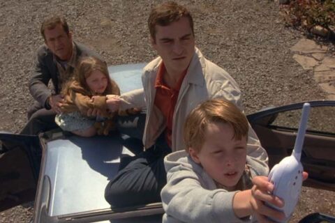 Signs 2002 Movie Scene Hess family using a baby monitor to listen for the aliens