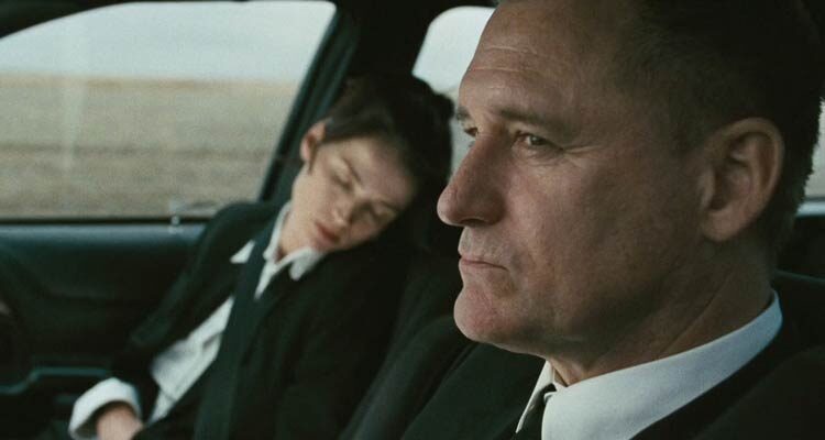 Surveillance 2008 Movie Scene Bill Pullman as Sam driving the car while Julia Ormond as Elizabeth is sleeping
