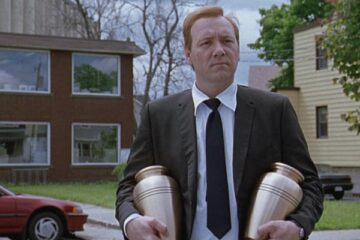 The Shipping News 2001 Movie Scene Kevin Spacey as Quoyle holding two urns in front of his home in New York