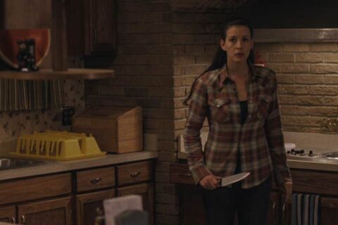 The Strangers 2008 Movie Scene Liv Tyler as Kristen holding a knife to fight off any intruders into her home