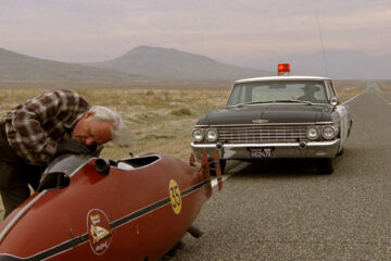 The Worlds Fastest Indian 2005 Movie Scene Anthony Hopkins as Burt Munro stopped by police while driving his 1920 Indian red motorcycle