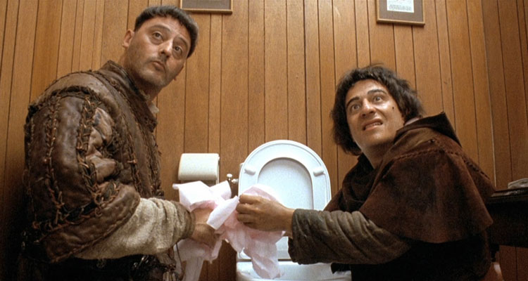 Les Visiteurs 1993 Movie Christian Clavier as Jacquard and Jean Reno as Godefroy in the bathroom drinking water from the toilet