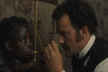 Man to Man 2005 Movie Hugh Bonneville measuring the skull of the pygmy they have captured in his cell scene