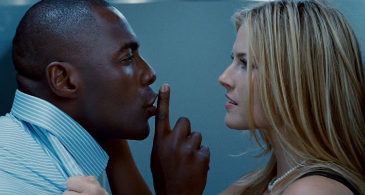 Obsessed 2009 Movie Scene Idris Elba as Derek shushing Ali Larter as Lisa in the bathroom