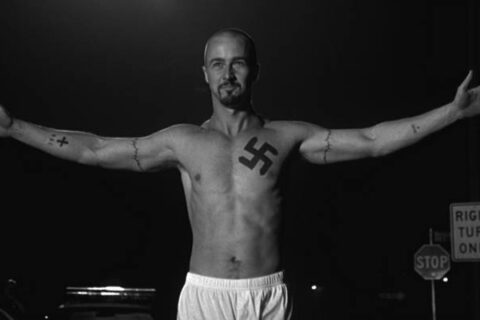 American History X 1998 Movie Scene Edward Norton as Derek in white underwear and a swastika tattoo on his chest after he killed black robbers