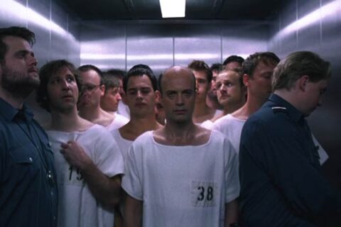 Das Experiment 2001 Movie Scene Patients riding in an elevator wearing white gowns