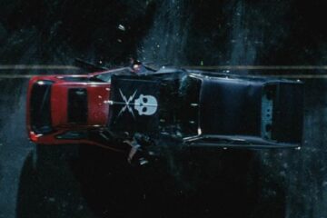 Death Proof 2007 Movie Scene A car crash between Stuntman Mike driving black 1971 Chevrolet Nova with a skull decal and the girls driving red Honda Civic