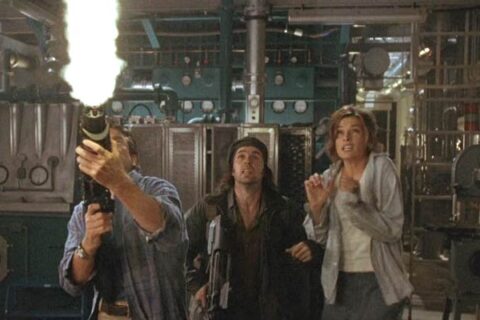 Deep Rising 1998 Movie Scene Treat Williams as Finnegan firing his gun at the monster, Kevin J. O'Connor as Pantucci and Famke Janssen as Trillian afraid