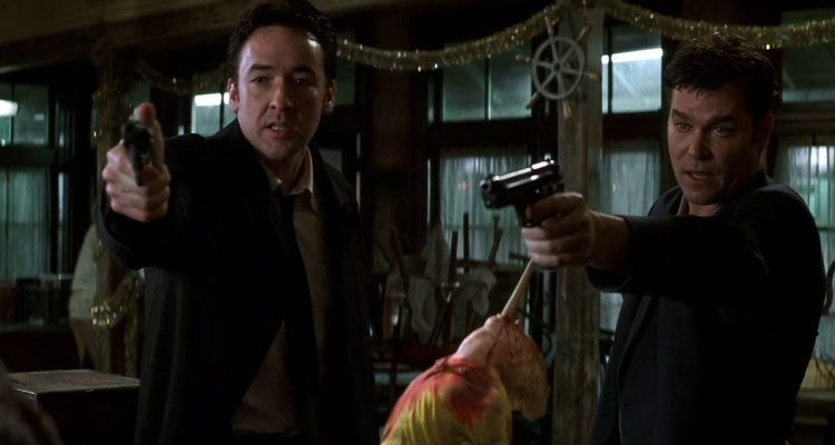 Identity 2003 Movie Scene John Cusack as Ed and Ray Liotta as Rhodes holding guns pointed at someone