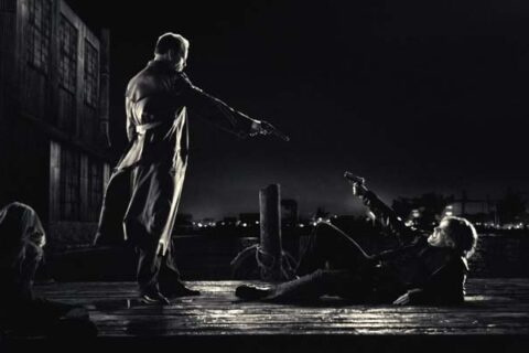 Sin City 2005 Movie Scene Bruce Willis as Hartigan holding a gun at the pier