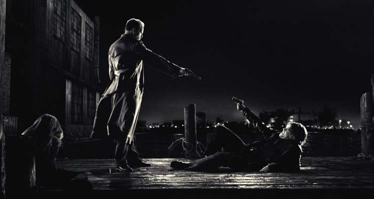 Sin City 2005 Movie Scene Bruce Willis as Hartigan holding a gun at the pier