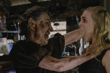 Drag Me to Hell 2009 Movie Scene Lorna Raver as Ganush shoving her fist into Alison Lohman as Christine Brown's mouth