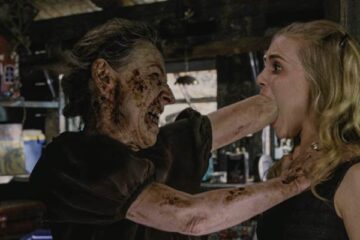 Drag Me to Hell 2009 Movie Scene Lorna Raver as Ganush shoving her fist into Alison Lohman as Christine Brown's mouth
