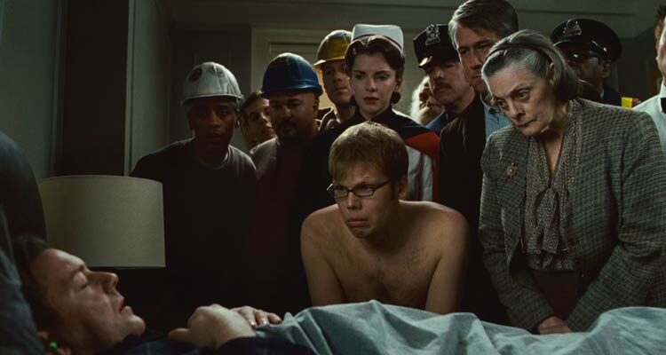 Ghost Town 2002 Movie Scene Ricky Gervais as Pincus sleeping while all the ghosts are looking at him