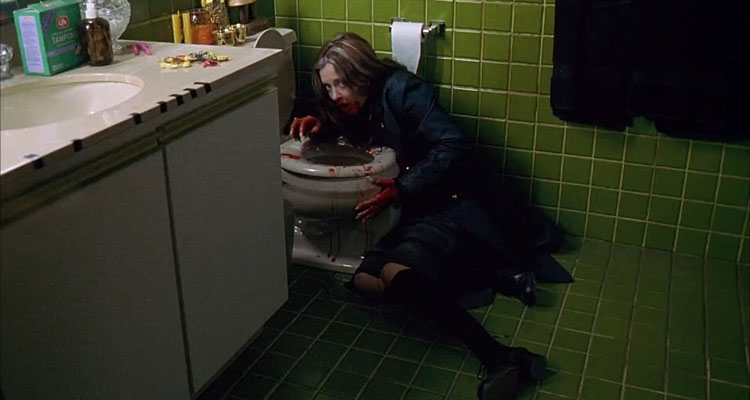 Ginger Snaps 2000 Movie Scene Katharine Isabelle as Ginger all bloody vomiting blood in the toilet
