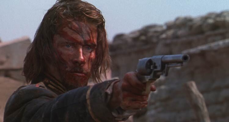 Ravenous 1999 Movie Scene Guy Pearce as John Boyd with a bloody face holding a gun