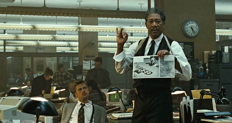 Se7en 1995 Movie Scene Morgan Freeman as Somerset listing the seven deadly sins as the killers motivation in the police station with Brad Pitt as Mills watching