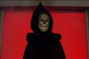 Skeleton Man 2004 Movie Scene Skeleton Man wearing a garbage bag cape and a skull mask entering a chemical plant