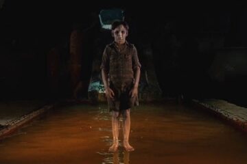 The Devils Backbone 2001 Movie Scene A ghost of a young boy hovering above the pool in the basement of the orphanage