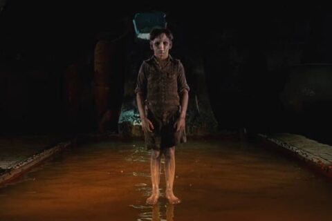 The Devils Backbone 2001 Movie Scene A ghost of a young boy hovering above the pool in the basement of the orphanage