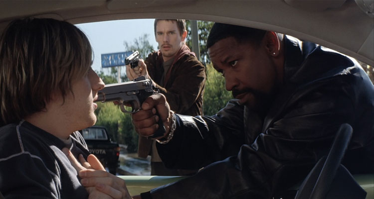 Training Day 2001 Movie Scene Denzel Washington as Alonzo holding a gun pointed to the driver of the car with Ethan Hawke as Jake backing him up