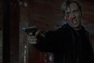 8MM 1999 Movie Scene Nicolas Cage as Tom Welles holding a gun and screaming