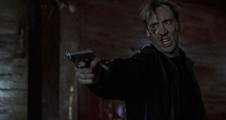 8MM 1999 Movie Scene Nicolas Cage as Tom Welles holding a gun and screaming