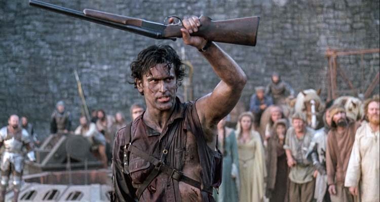 Army of Darkness 1992 Movie Scene Bruce Campbell as Ash showing his shotgun he calls boomstick to the villagers