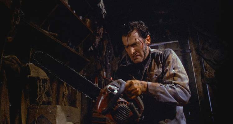 Evil Dead II 1987 Movie Scene Bruce Campbell as Ash fixing a chainsaw to his severed hand