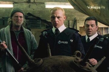 Hot Fuzz 2007 Movie Scene Simon Pegg as Nic, Nick Frost as Danny and David Bradley as Arthur all looking at an unexploded mine from WWII