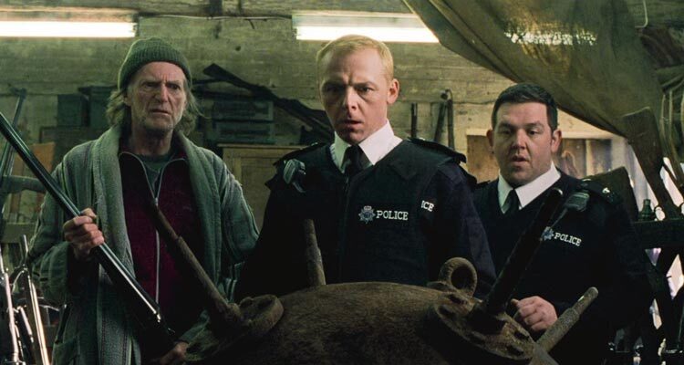 Hot Fuzz 2007 Movie Scene Simon Pegg as Nic, Nick Frost as Danny and David Bradley as Arthur all looking at an unexploded mine from WWII