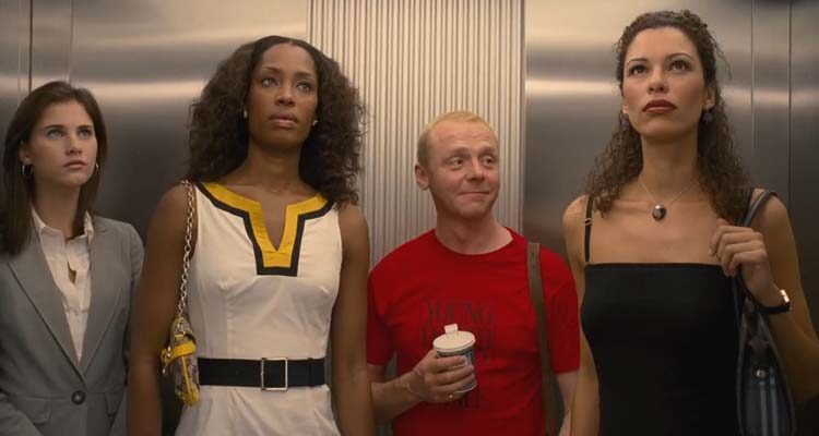 How to Lose Friends Alienate People 2008 Movie Scene Simon Pegg as Sidney Young in an elevator with three tall and beautiful models