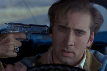 Red Rock West 1993 Movie Scene Nicolas Cage as Michael driving the car with a gun pointed to his head