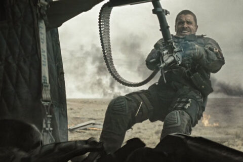 Terminator Salvation 2009 Movie Scene Christian Bale as John Connor using a minigun on a helicopter to shoot a killer robot