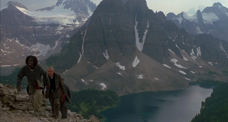 The Edge 1997 Movie Anthony Hopkins, Alec Baldwin and Harold Perrineau climbing a mountain