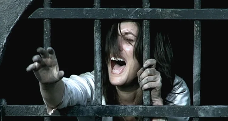 Them 2006 Movie Scene Olivia Bonamy as Clementine screaming after a hooded man starts chasing her in dark tunnels