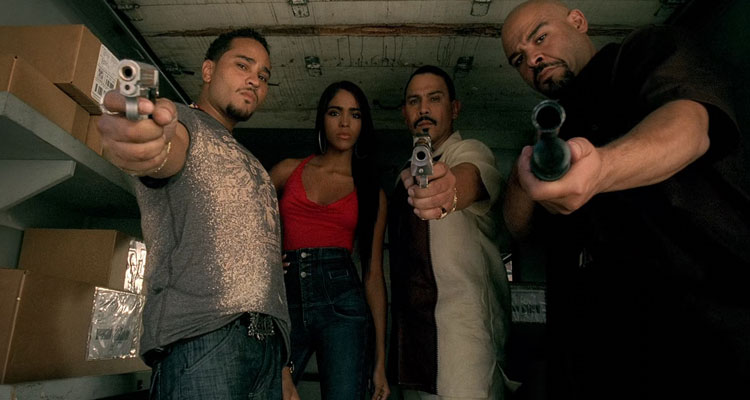 Next Day Air 2009 Movie Scene Cisco Reyes as Jesus, Emilio Rivera as Bodega, Lobo Sebastian as Rhino and Yasmin Deliz as Chita holding guns