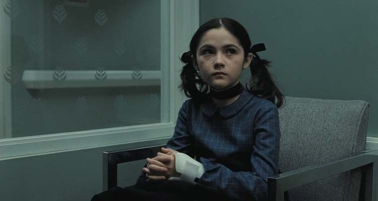 Orphan 2009 Movie Scene Isabelle Fuhrman as Esther sitting in a hospital waiting room after she tried to kill Daniel
