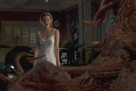 Slither 2006 Movie Scene Elizabeth Banks as Starla in a white nightgown disgusted by a strange and slimy creature