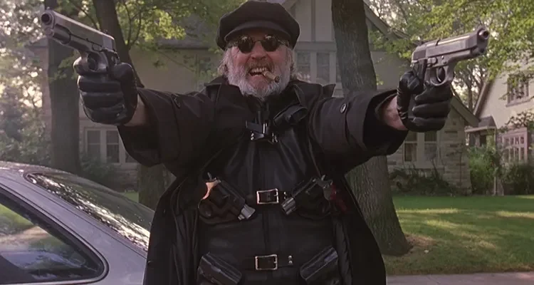 The Boondock Saints 1999 Movie Scene Billy Connolly as Il Duce holding two guns and smoking a cigar