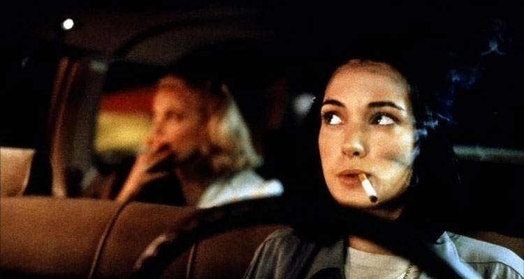 Night on Earth 1991 Movie Winona Ryder as Corky smoking a cigarette with Gena Rowlands doing the same in the backseat of the taxi